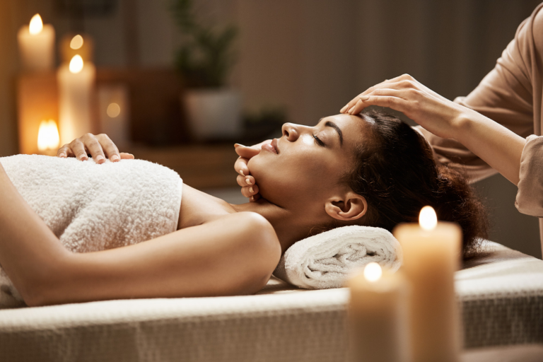 attractive-african-woman-enjoying-face-massage-spa-salon